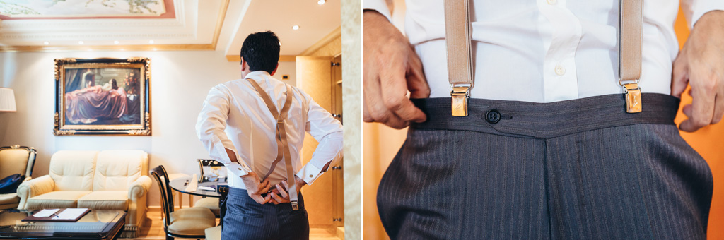 Fotografo Matrimonio Villa Caroli Zanchi LO sposo aggiusta i pantaloni e le bretelle durante la preparazione