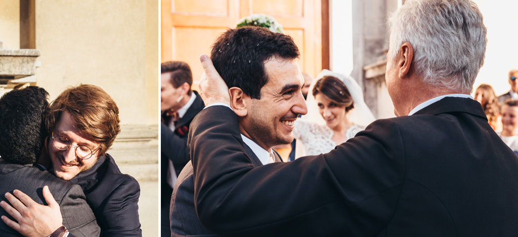 Fotografo Matrimonio Villa Caroli Zanchi Gli invitati si abbracciano e Riccardo riceve un buffetto dal padre della sposa