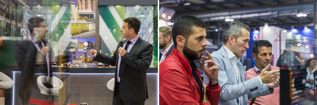 Fotografo Eventi Fiera Milano Alcuni partecipanti osservano il vetro di un padiglione
